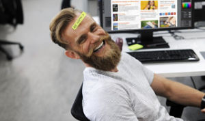 website developer with new obooko site on screen